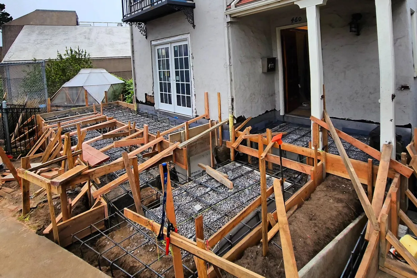 Reinforcing steel and formwork for the West Portal ADA ramp before the pour — San Francisco