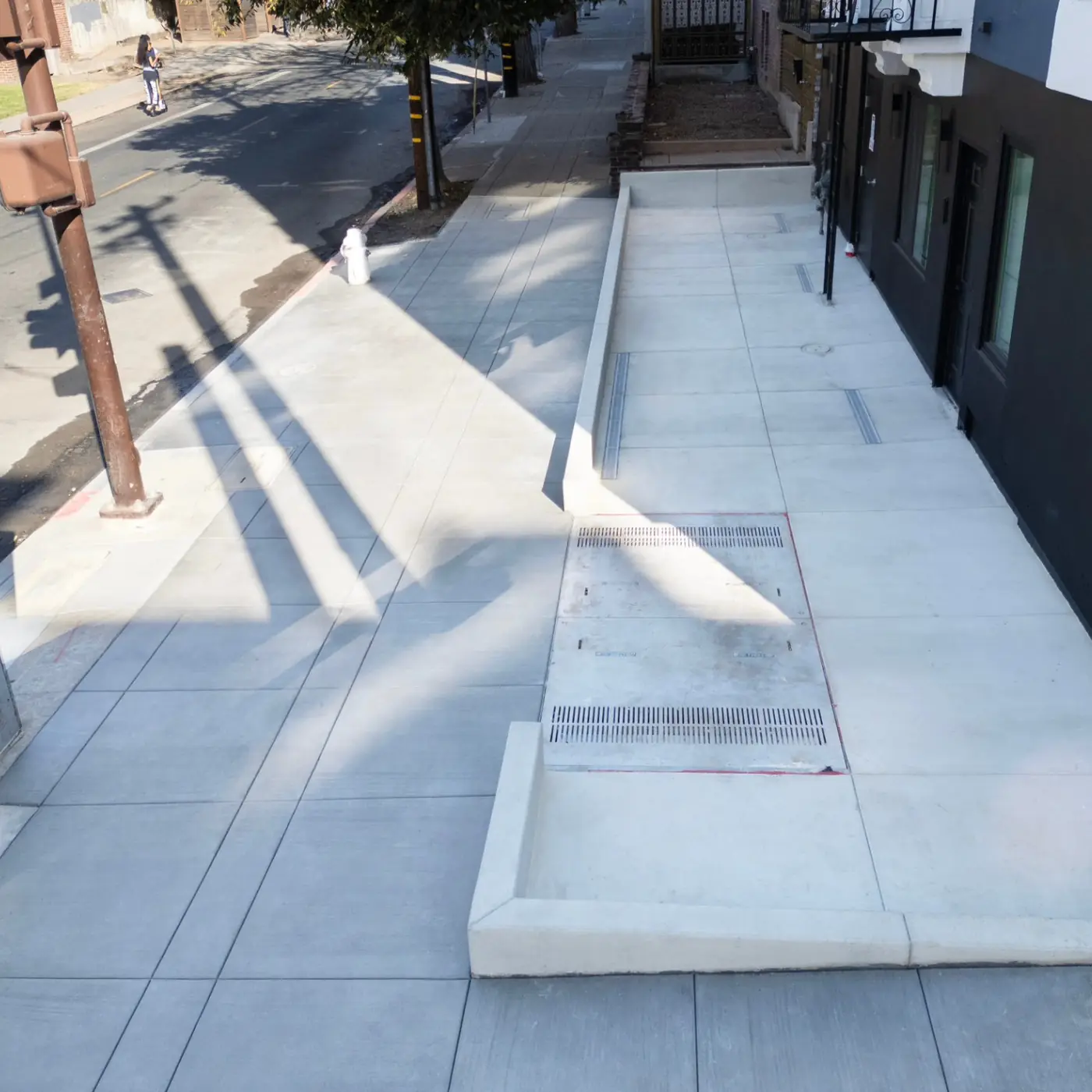 Overhead sidewalk + driveway apron w/ channel drain — Durant Sidewalk — UC Berkeley, Berkeley, CA