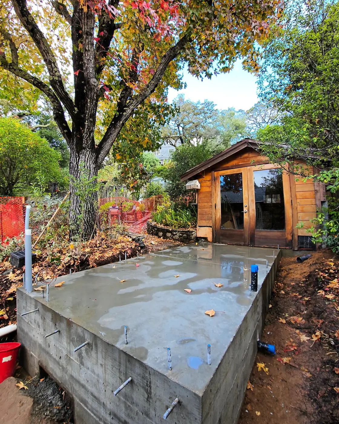 Finished slab w/ stem walls, anchor bolts, fall tree — Backyard ADU Foundation, SF Bay Area