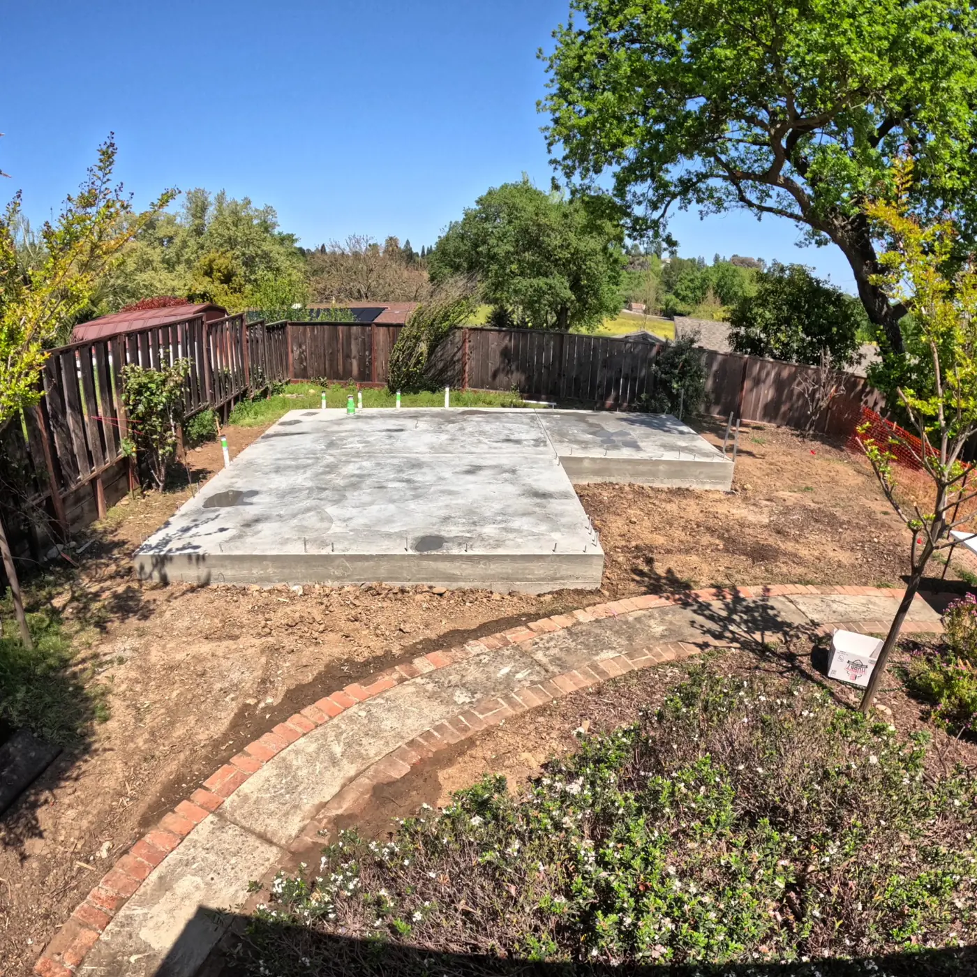 Aerial completed slab w/ stem walls curing — Pleasant Hill ADU Foundation, Pleasant Hill, CA
