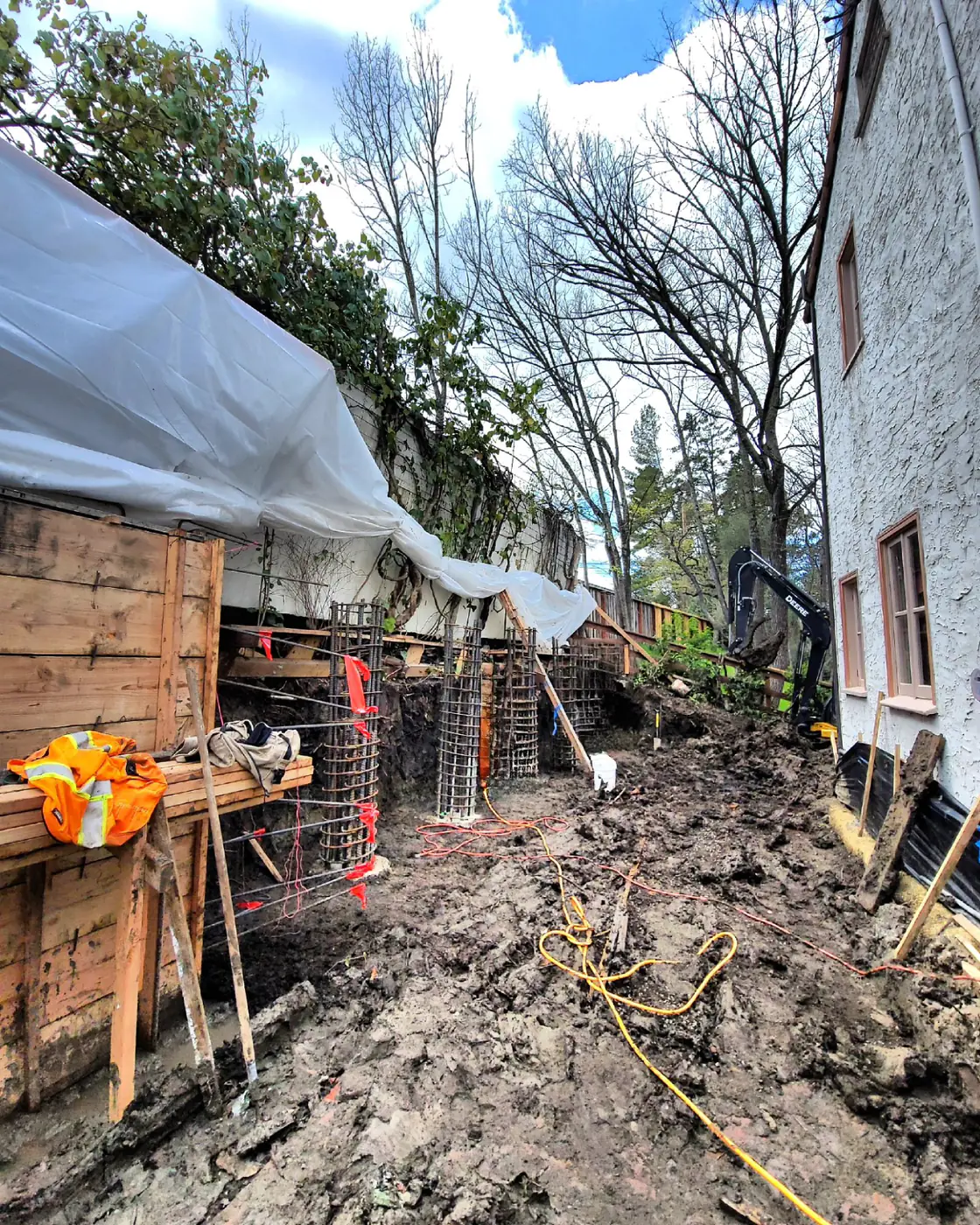 Excavation trench, rebar pier stubs, shoring