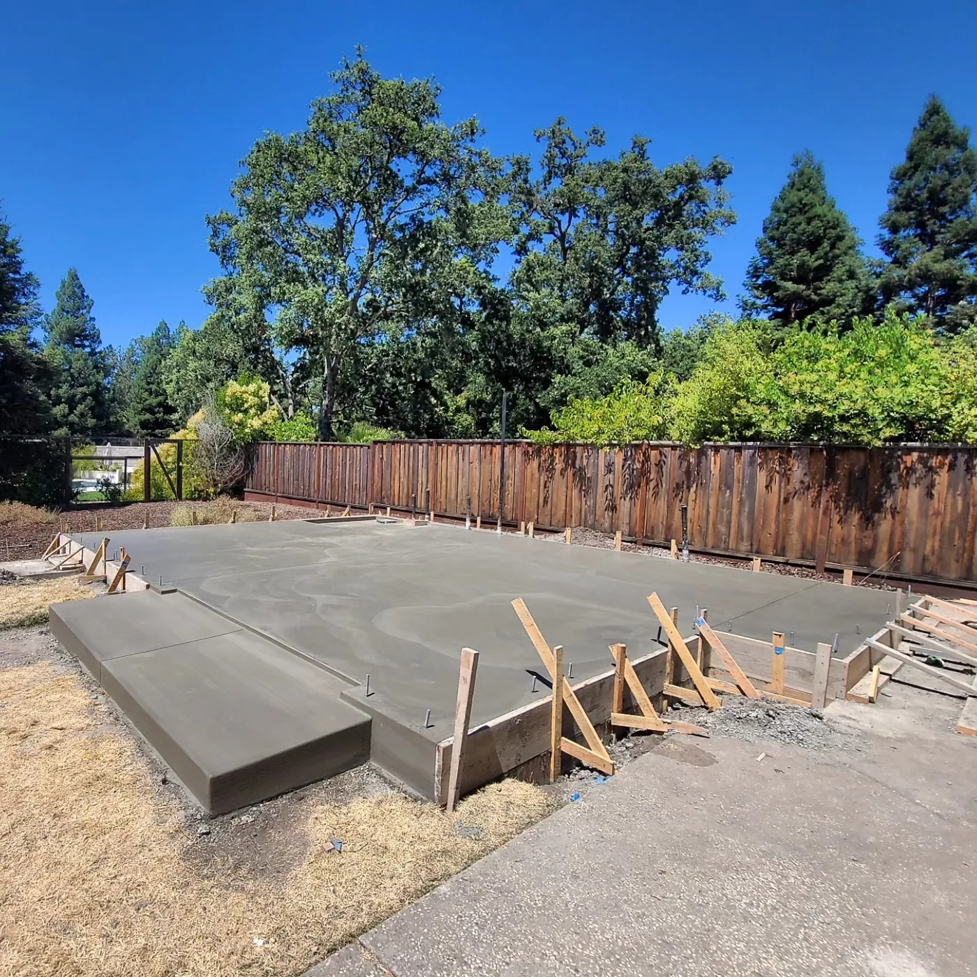 The cured slab with anchor bolts, forms still on the edges — Alamo ADU Foundation, Alamo, CA