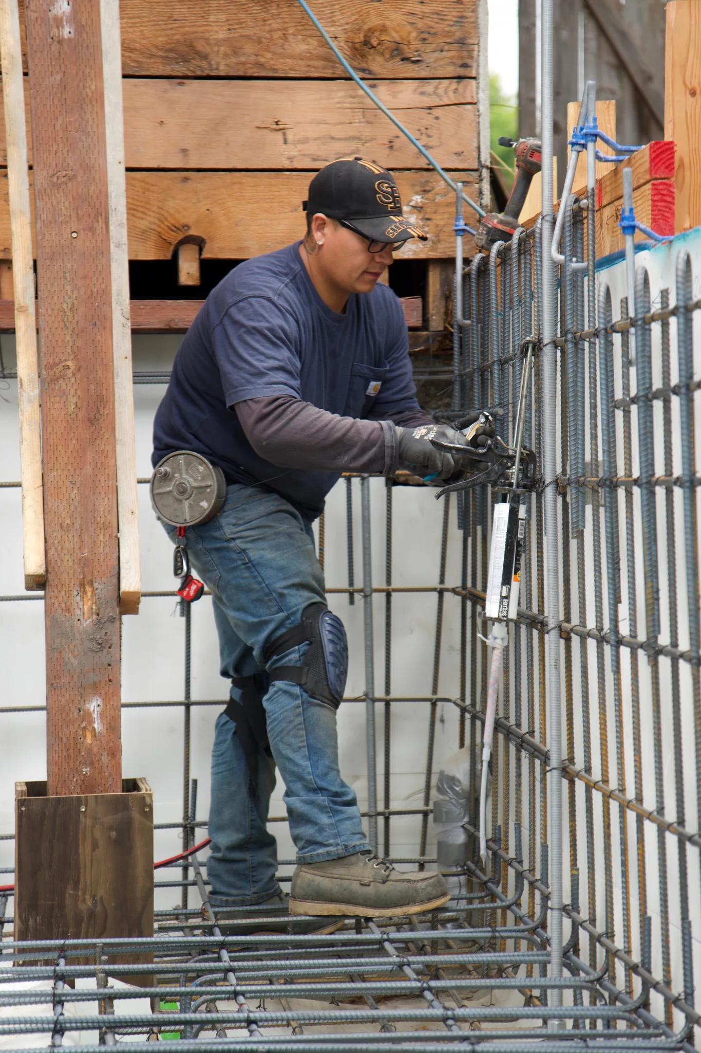 New Edge crew member tying reinforcing steel for the perimeter walls — Albany Home Addition Foundation, Albany, CA