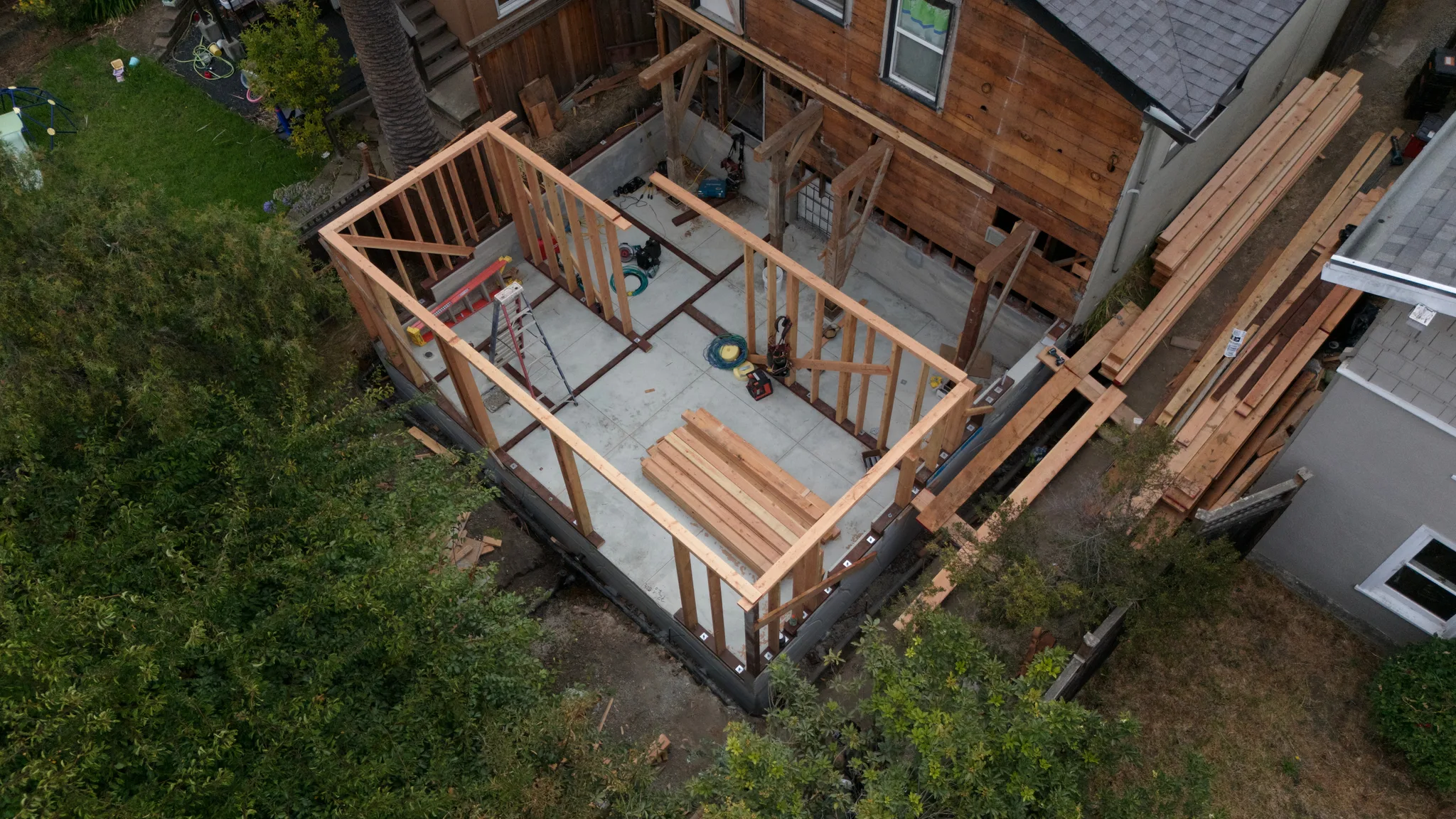 The completed addition foundation carrying framing at the rear of the home — Albany Home Addition Foundation, Albany, CA