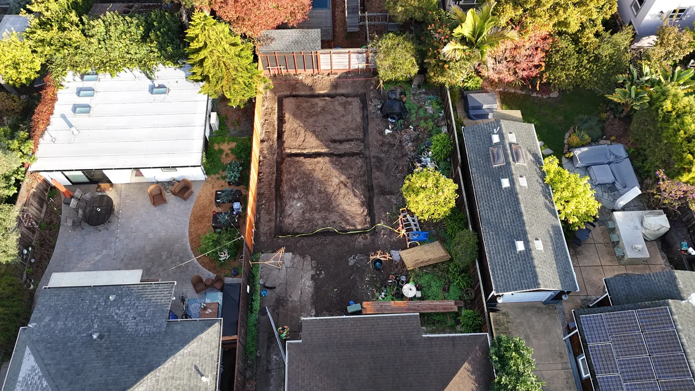 The excavated ADU footprint between the neighboring houses before forming — Berkeley Backyard Detached ADU, Berkeley, CA