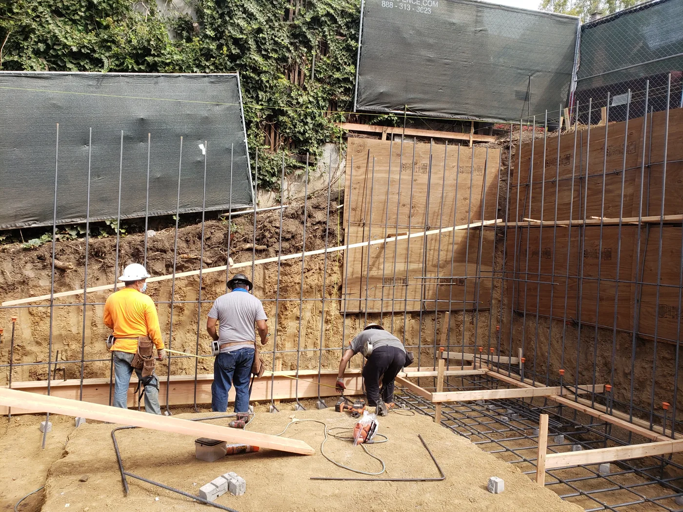 Setting rebar and forms at the base against the shoring wall — Berkeley Student Housing Foundation, Berkeley, CA