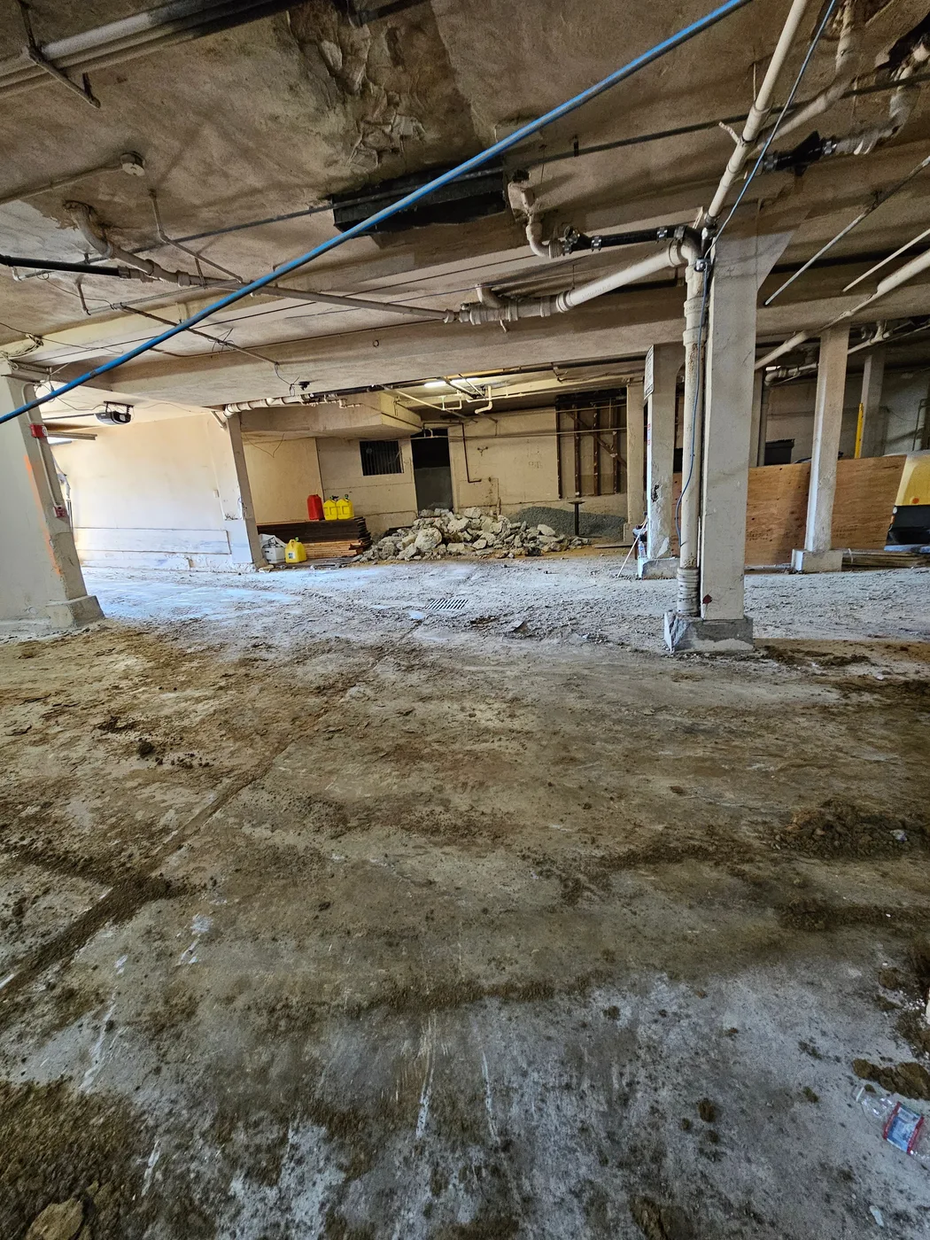 The old garage level stripped and cleared before the dig — Durant Basement Foundation, Berkeley, CA